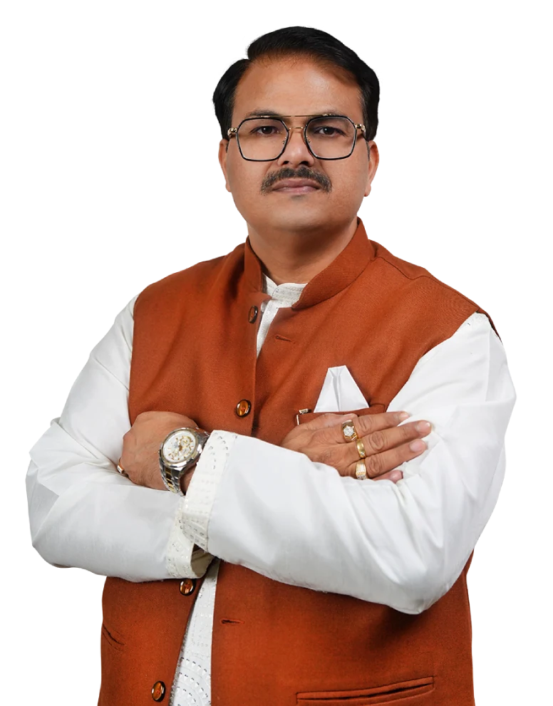 Dr. Hemant Barua wearing an orange waistcoat